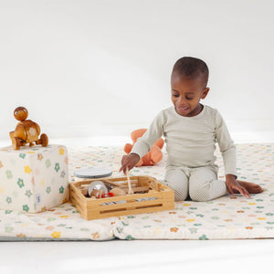Playful Posies Play Cube from an angle, featuring vibrant colors and engaging textures for baby playtime.