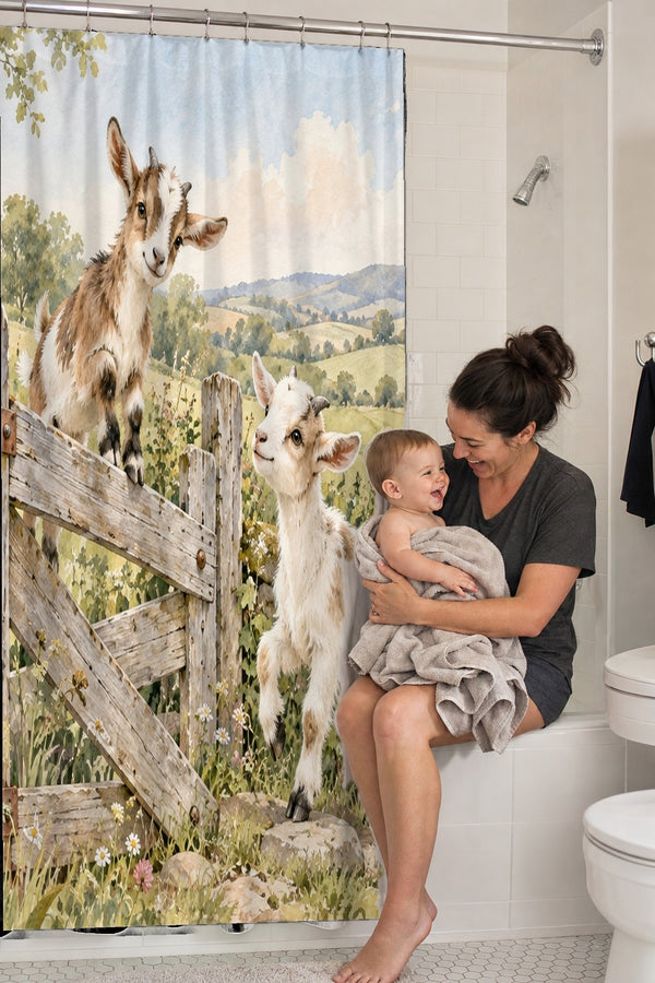 Mom holding her baby on the tub edge next to the Baby Goats Farm shower curtain