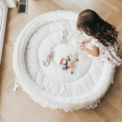 Macrame round play mat for babies, soft and stylish, perfect for playtime and nursery decor.