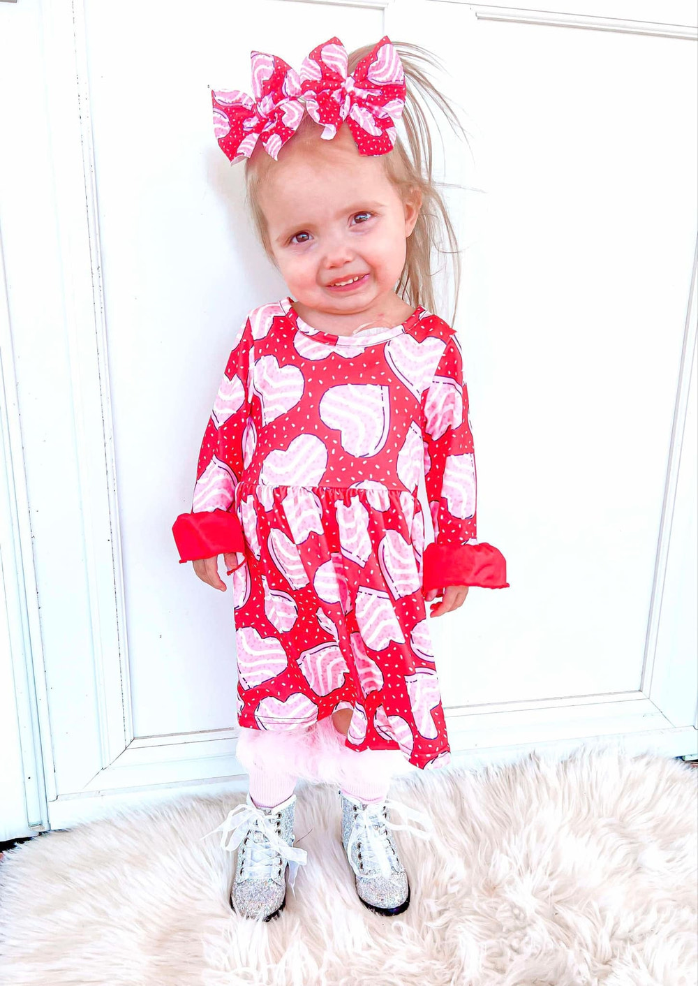 Red bell sleeve dress for babies, perfect for special occasions and everyday wear.