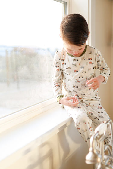 Tiny Tractors 2pc Bamboo Pajamas for babies, soft and breathable sleepwear in a playful design.