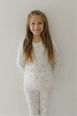 Bamboo two-piece pajamas for babies, featuring Autism Awareness design by Charli Counts. Soft and comfortable sleepwear.