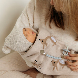 Luxury cotton deer knit swaddle baby blanket in a cozy angle, perfect for keeping your little one warm and stylish.