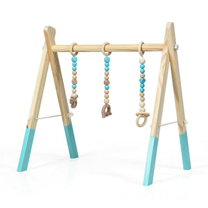 Portable wooden baby gym with teething toys, perfect for newborns, shown from angle 4.