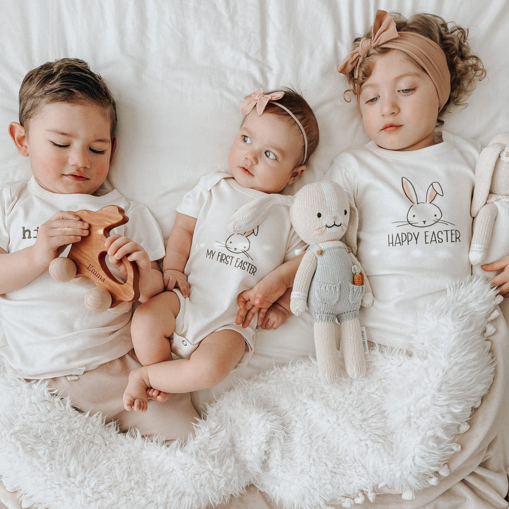 "Graphic bodysuit for babies: 'My First Easter' short sleeve onesie, perfect for celebrating the holiday."
