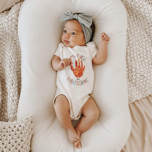 Thanksgiving-themed graphic bodysuit for babies, short sleeve, shown from angle 2. Perfect for holiday celebrations!