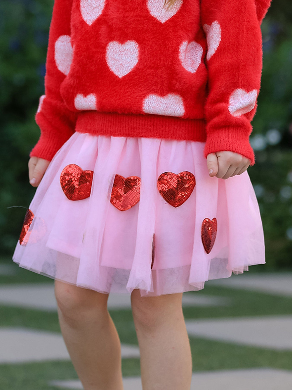 Girls' Valentine's Day skirt featuring sequined heart appliques, perfect for festive occasions.