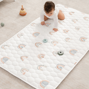 Rainbow play mat with non-slip bottom, angled view, perfect for safe and fun baby playtime.
