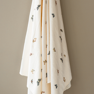 Minky Stretch Luxe Swaddle Blanket in soft fabric, perfect for keeping your baby cozy and comfortable.