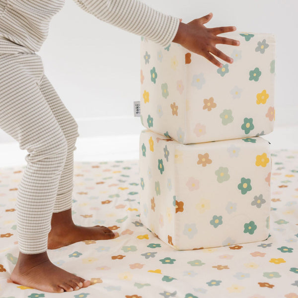 Colorful Playful Posies Play Cube from an angled view, designed for engaging baby playtime and development.