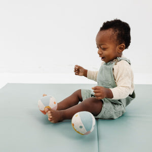 Sage Vegan Leather Play Mat from angle 3, perfect for babies and toddlers, stylish and easy to clean.
