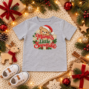 Mama's Little Snowflake toddler t-shirt in heather grey, Christmas flat lay