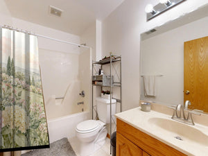 Hydrangea Garden shower curtain on a tub shower combo in an American family bathroom