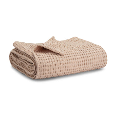 Blush baby waffle blanket, soft and cozy, perfect for swaddling and cuddling.