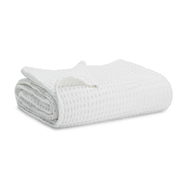 Soft white baby waffle blanket, perfect for cozying up your little one. Ideal for nurseries and baby gifts.