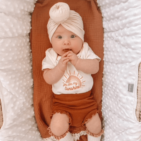 Graphic bodysuit "You Are My Sunshine" for babies, short sleeve design, perfect for playful outfits.