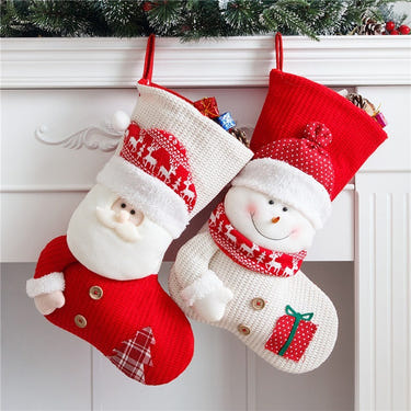 Knitted Christmas stocking featuring Santa design, perfect for festive baby decor and holiday celebrations.