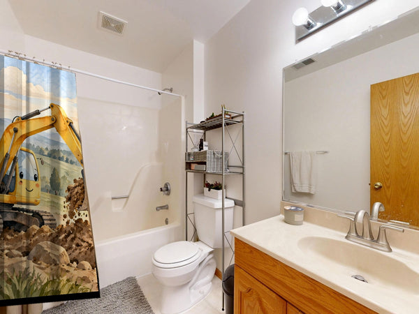 Sunrise Excavator shower curtain on a tub shower combo in an American family bathroom
