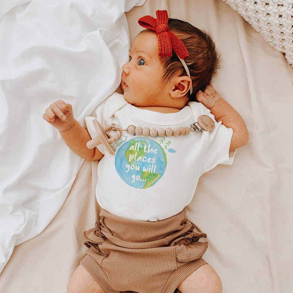 Graphic short sleeve bodysuit for babies featuring "Places You Will Go" design. Perfect for adventurous little ones!