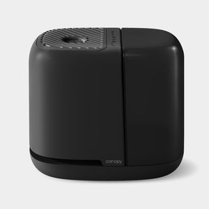 "Bedside Humidifier 2.0 for babies, sleek design, angle view, enhances air quality for better sleep."
