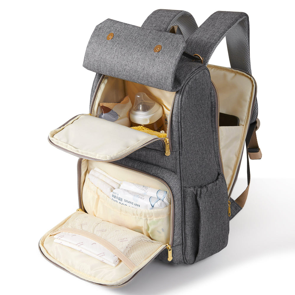 Stylish canvas diaper backpack for parents, featuring multiple pockets and a spacious design for baby essentials.