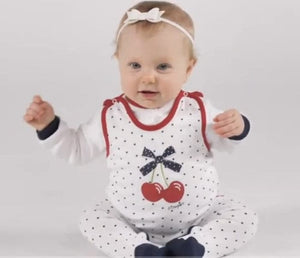 Girls cherry footed sleeveless bodysuit, snap closure, angle view showcasing cute design and soft fabric.