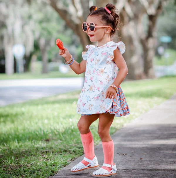 Pastel Floral Flutter Bapron for babies, shown at an angle, perfect for mealtime messes and stylish protection.
