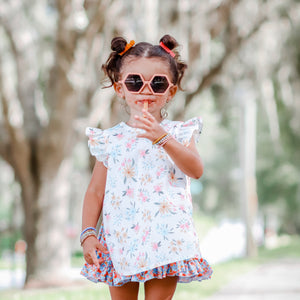 Pastel Floral Flutter Bapron for babies, angled view showcasing its vibrant design and practical features.