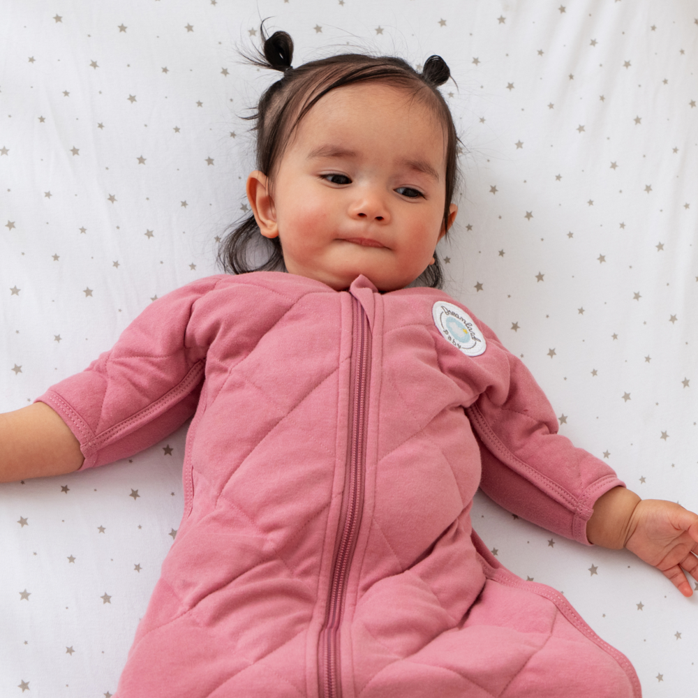 Dreamland Baby Dream Weighted Transition Swaddle arms-out sleep