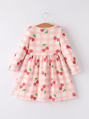 Waffle Cherry Girls Long Sleeve Dress in angle view, showcasing playful design and cozy fabric for stylish toddlers.