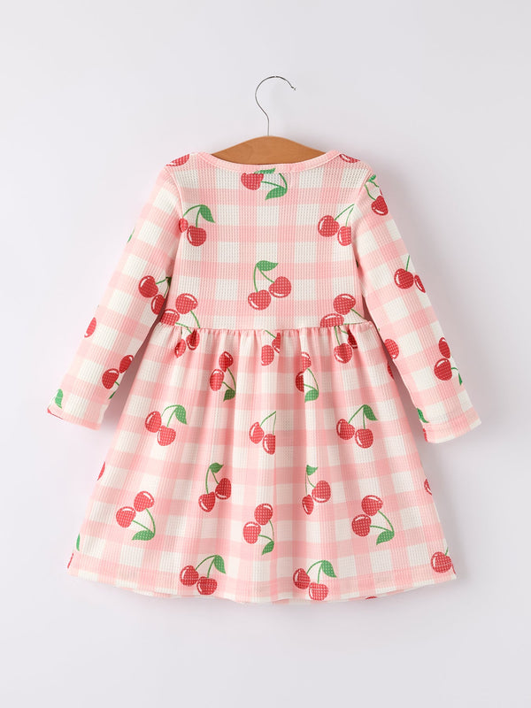 Waffle Cherry Girls Long Sleeve Dress in angle view, showcasing playful design and cozy fabric for stylish toddlers.