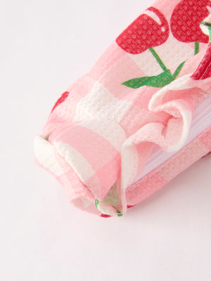 Waffle Cherry Plaid Girls' Romper at angle 4, showcasing a stylish and cozy outfit for babies.