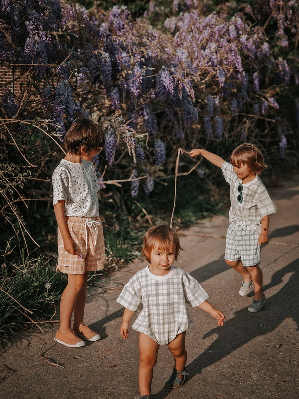 Organic cotton bubble romper in fern plaid, angle 16 view, perfect for stylish baby outfits.