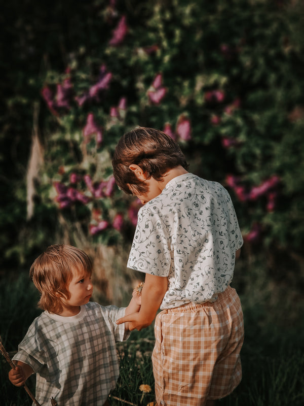 Organic cotton bubble romper in fern plaid, angle 11 view, perfect for stylish baby outfits.