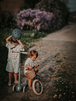 Organic cotton bubble romper in fern plaid, angled view showcasing soft fabric and playful design for babies.