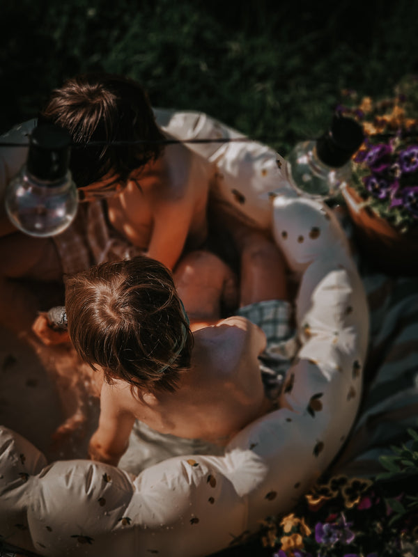Baby swim trunks in fern plaid, UPF protected, made from recycled materials, shown at angle 12.