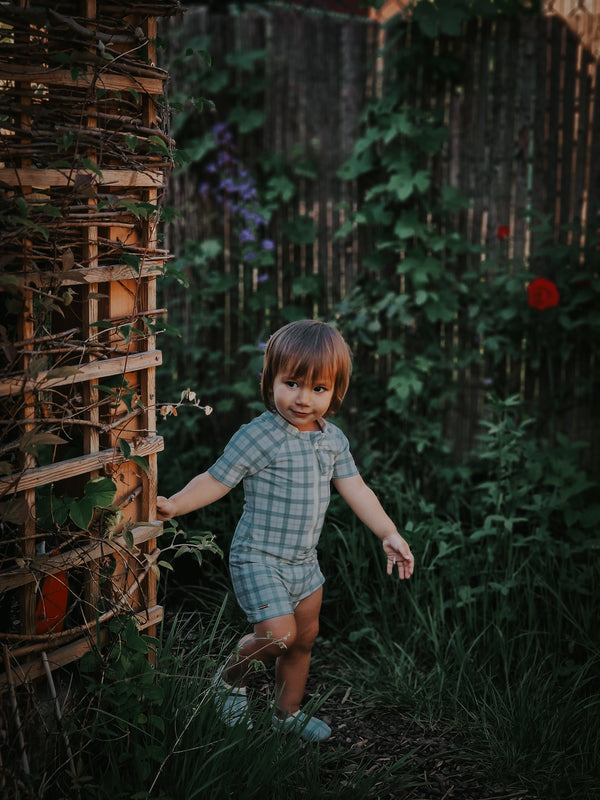 Short Sleeve Rashguard Swimsuit in Fern Plaid, UPF + Recycled, perfect for baby beachwear.