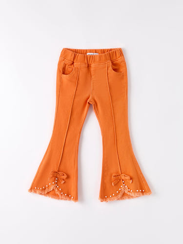 Orange flared elastic jeans for babies, stylish and comfortable for everyday wear.