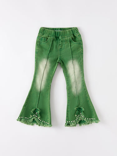 Green flared elastic jeans for babies, stylish and comfortable for everyday wear.