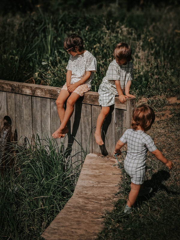 Short Sleeve Rashguard Swimsuit in Fern Plaid, UPF + Recycled, stylish and eco-friendly baby swimwear.
