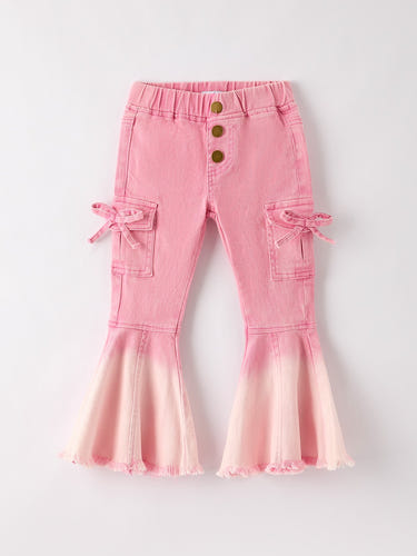 Pink bell bottom jeans for babies with frayed hem and cargo pockets, perfect for stylish little ones.