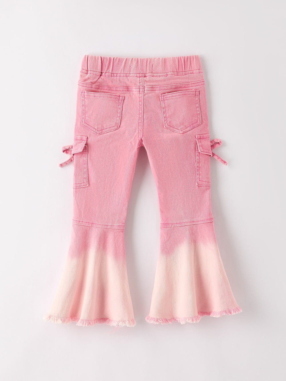 Pink bell bottom jeans for babies with frayed hem and cargo pockets, perfect for stylish little ones.