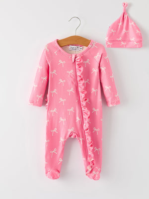 "Christmas Bow Pink Romper with Hat - Adorable and stylish baby outfit for festive occasions."