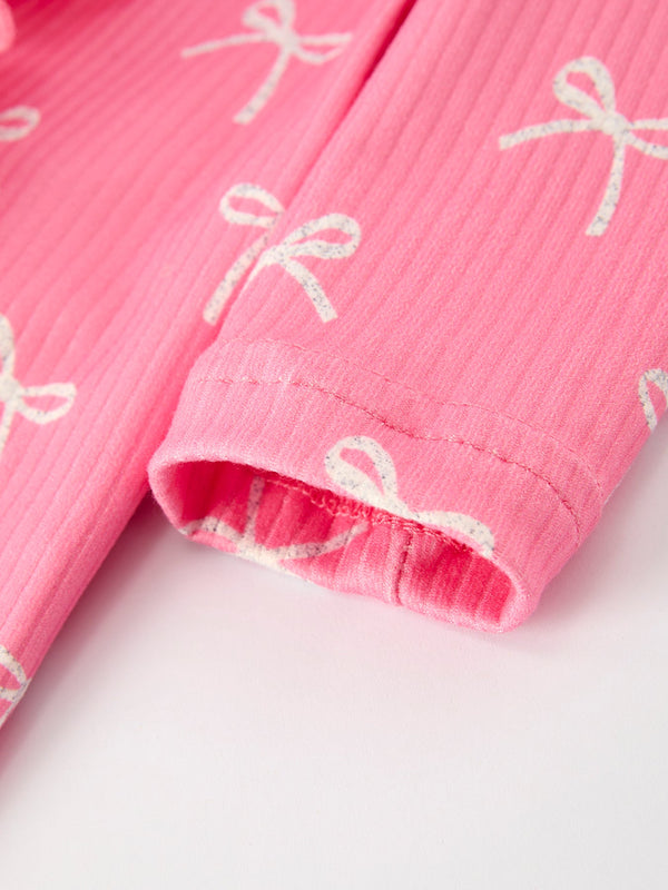 Christmas Bow Pink Romper with Hat - Adorable baby outfit for festive occasions, shown from angle 4.