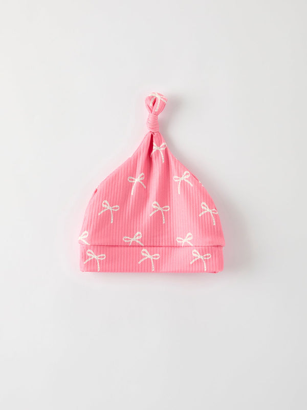 Christmas Bow Pink Romper with Hat - Adorable baby outfit for festive occasions, shown at angle 6.