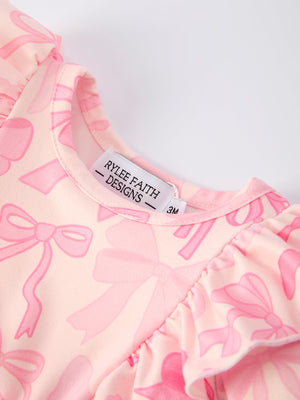 Girls pink bow print long sleeves romper, stylish and comfortable for infants, showcased from angle 3.
