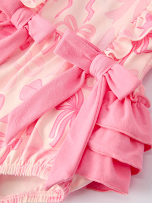 Girls pink bow print long sleeves romper, stylish and comfortable for infants, shown from angle 4.