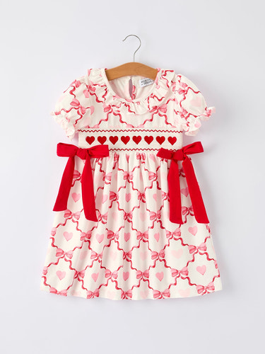 Girls Valentine dress with heart embroidery and bowknot design, perfect for special occasions.
