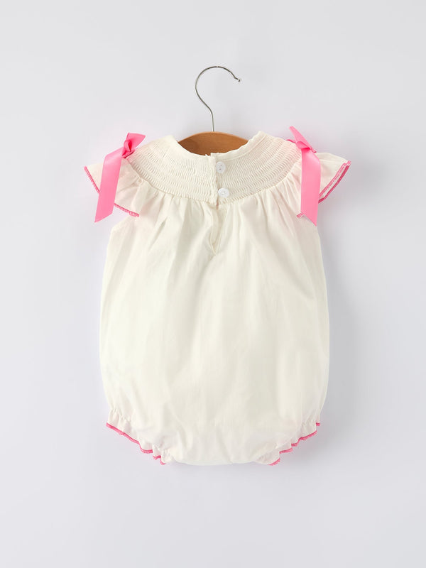 Fall white baby girls romper with pink bow embroidery, shown from angle 2. Perfect for stylish little ones!