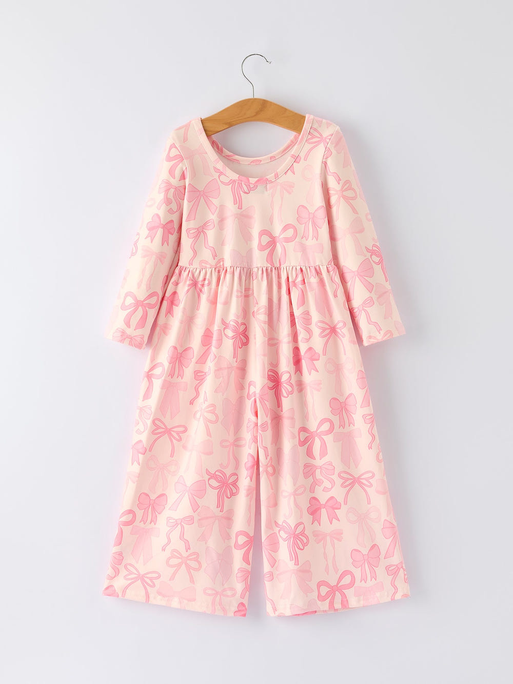Girls pink bow print long sleeve jumpsuit, perfect for stylish and comfortable baby outfits.